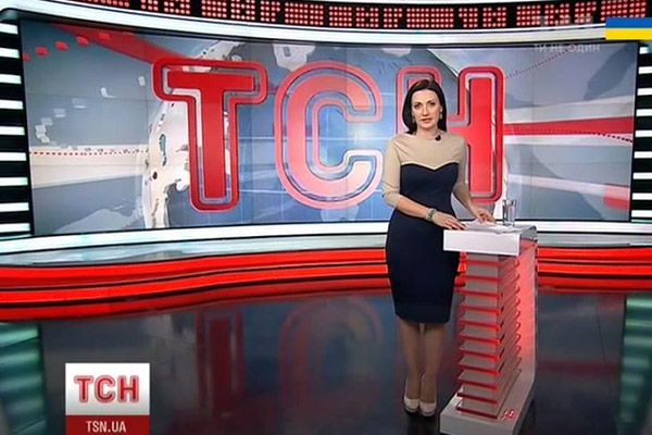 TSN news anchor presenting in a stylish studio with modern design